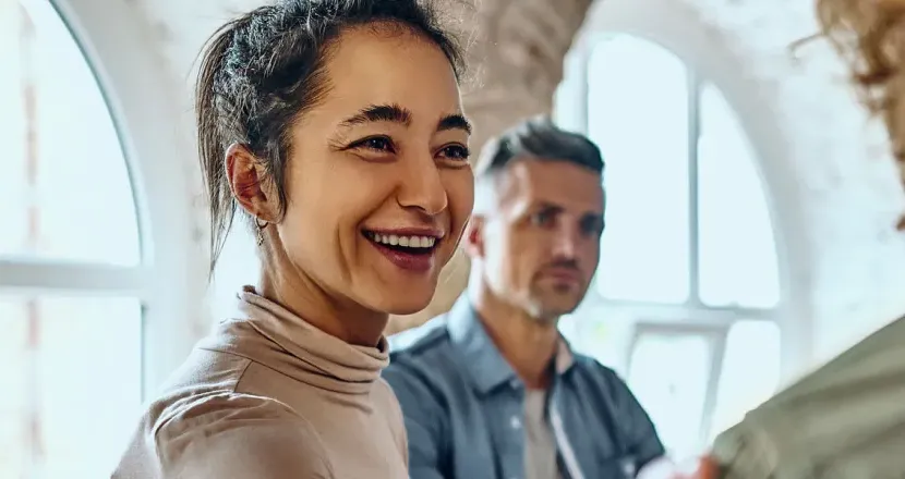 Health and Human Services Worker Smiling at Patient with Hand on Shoulder